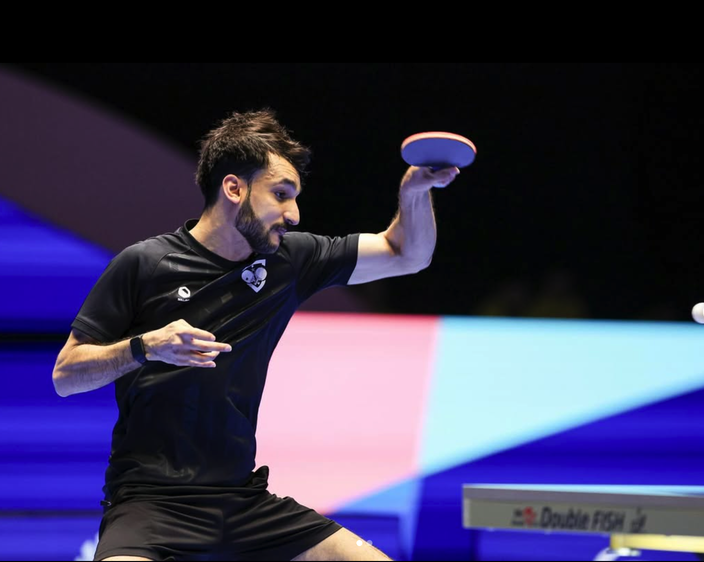Professional table tennis player in action during competitive match